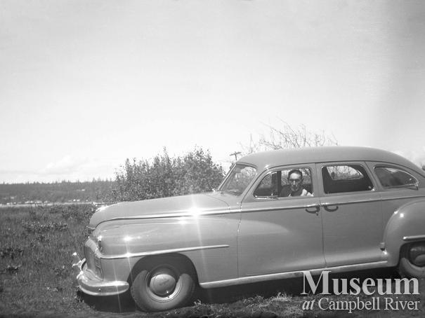 Johnny Ferry Sr. in a car
