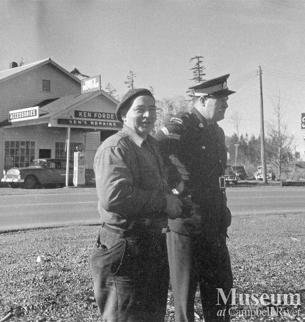 Ken Forde (left), in front of his place of business