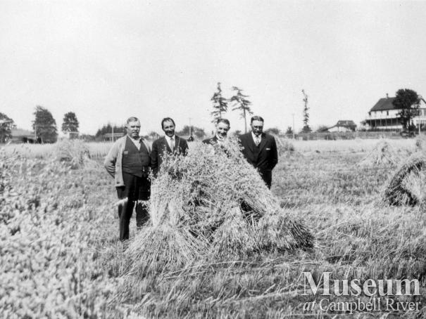 Charles Thulin and company in hayfield