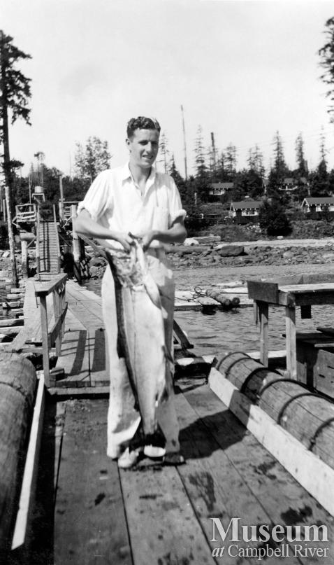 B. Smith with a fish on the Painter's Lodge wharf