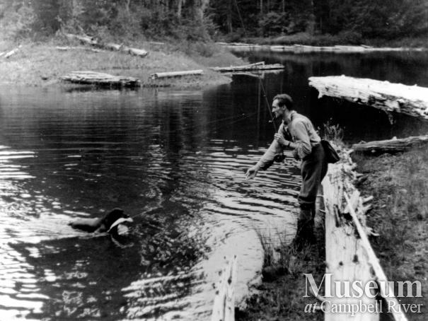 Roderick Haig-Brown with dog Souse fishing