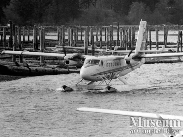 An Island Air seaplane in front of the ERT log dump