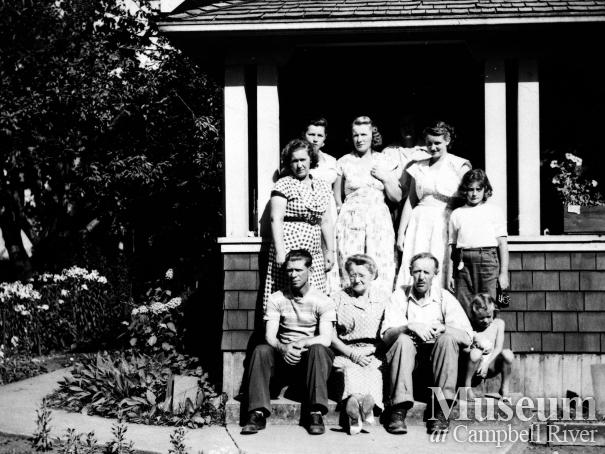 Group on the front steps of the Petersen family home, Campbellton  