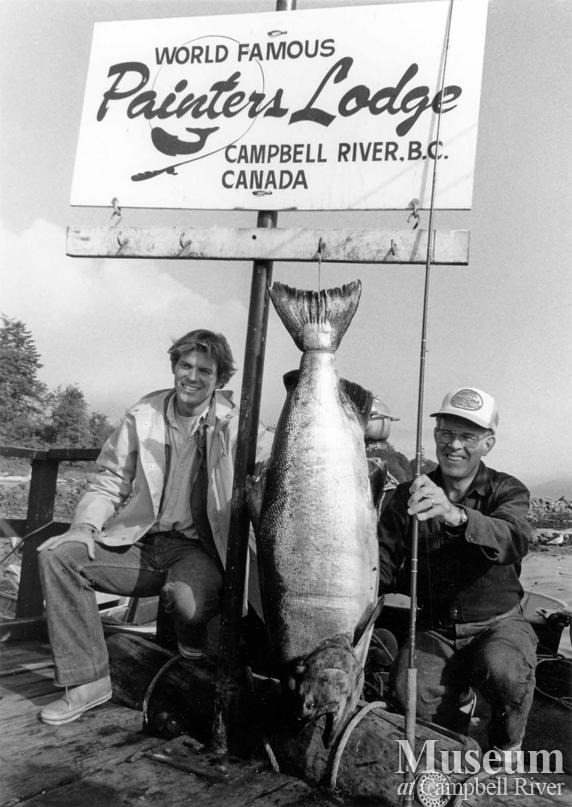 Two unknown anglers with fish