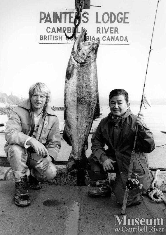 Two unknown anglers with fish