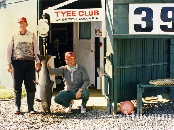 Two unknown anglers with fish