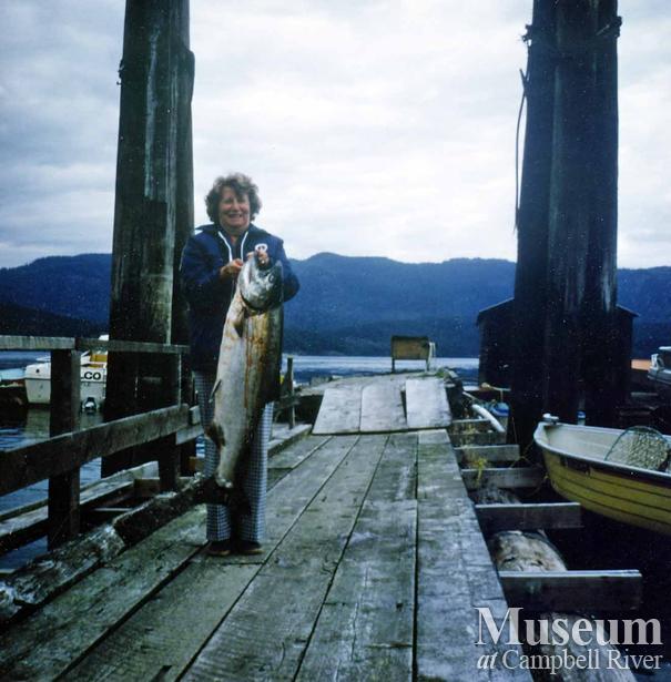 Unknown lady angler with fish