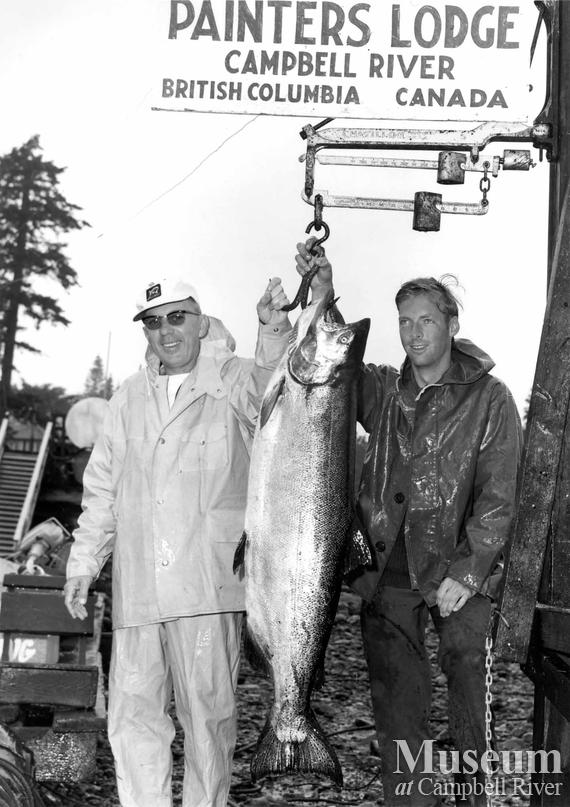 John de Glenn with his catch, and another man