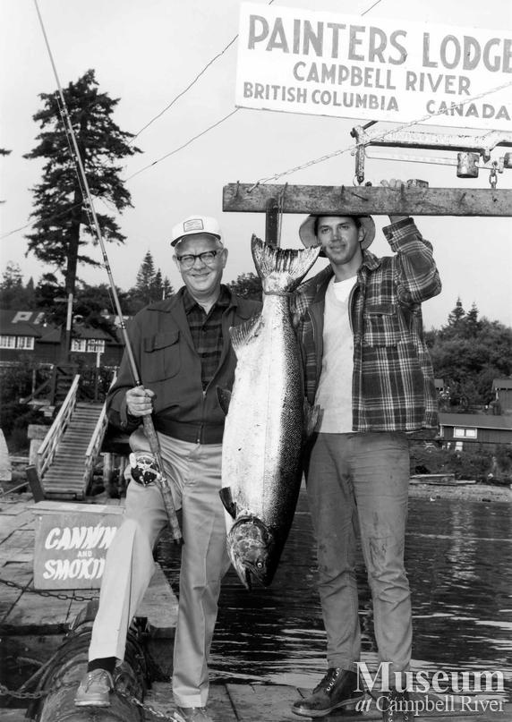 Harold Greystone with his catch, and another man