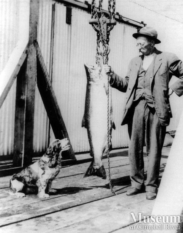 Man with a Spaniel dog