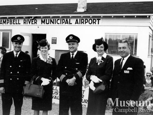 Flight crew in front of Campbell River Municipal Airport terminal