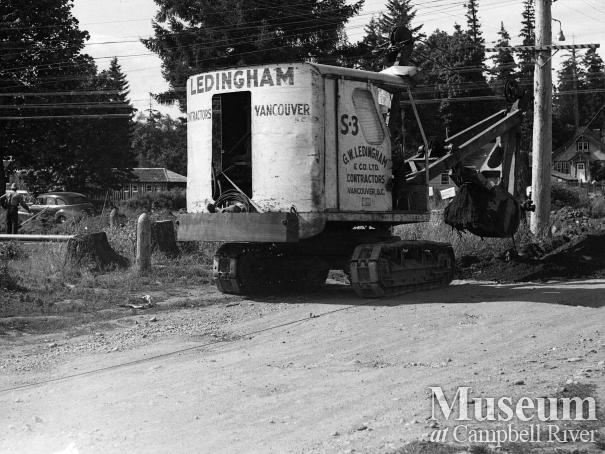 Installing the waterline along the Island Hwy at Campbellton