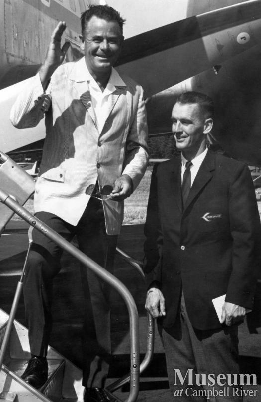 Actor Glenn Ford boards a Pacific Western Airlines plane