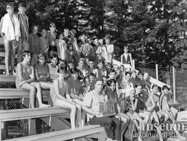 Members of the Campbell River Swim Club on bleachers at Centennial Park pool 