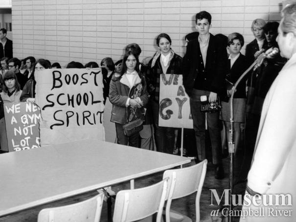 John Young speaks to his students