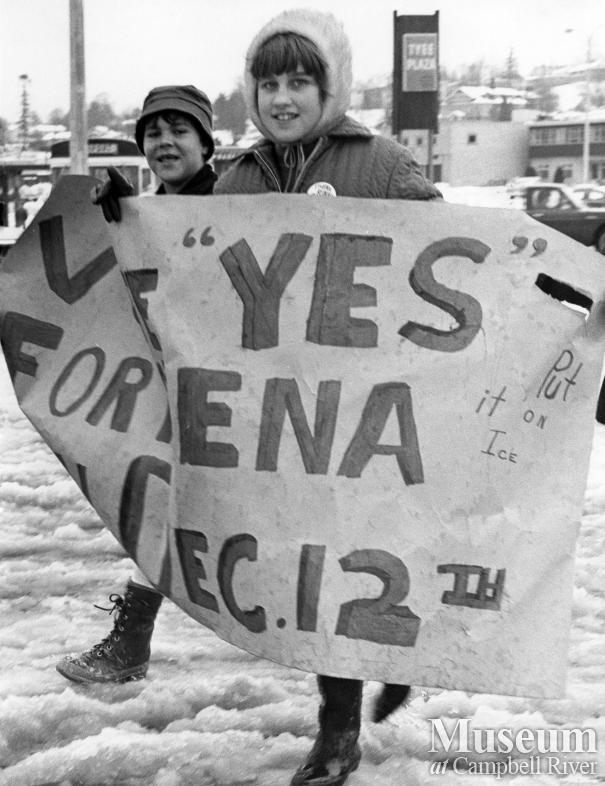 Youngster walk around town with posters for new arena